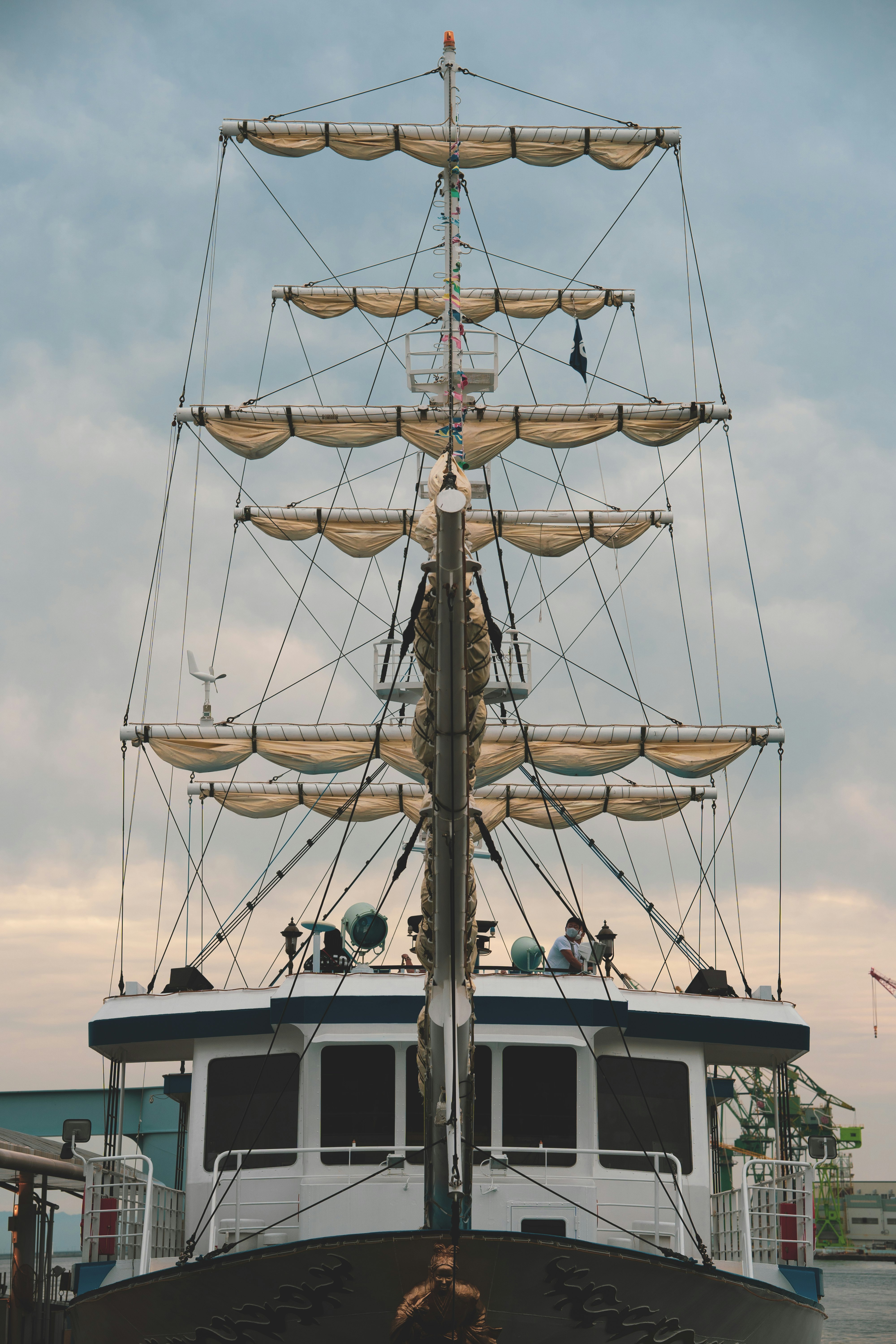 white and black sail boat on sea during daytime